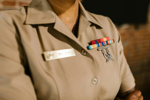 closeup of person in military uniform with insignia