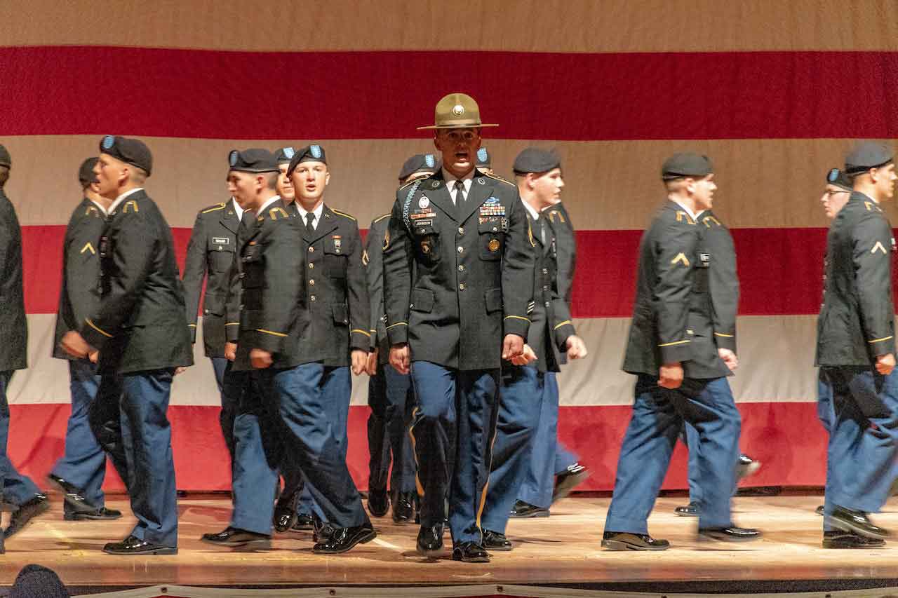 military marching on stage in Army service uniform