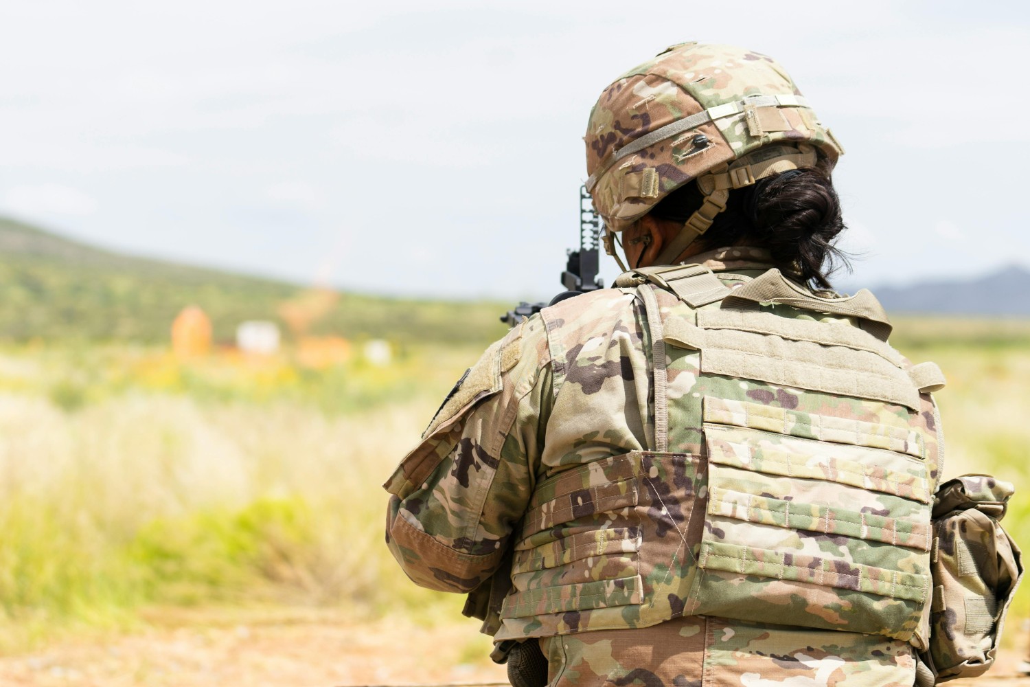 soldier in field wearing MOLLE vest